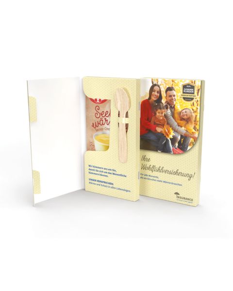 Dr. Oetker vanilla cup pudding in a folding cardboard box with spoon and promotional print