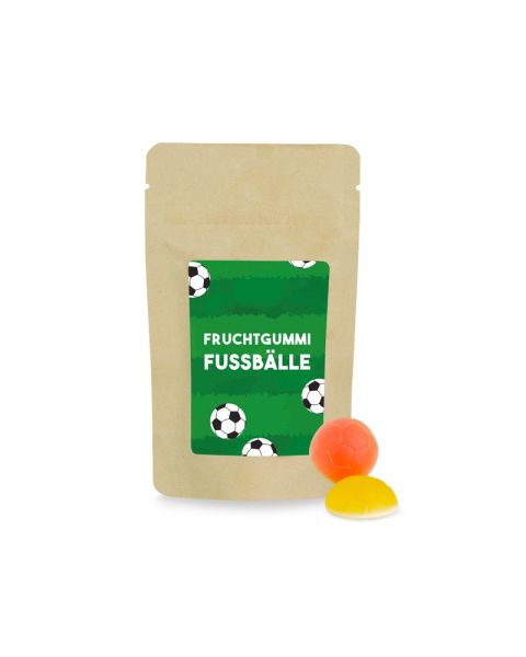 50 g Süßwaren nach Wahl im Papierdoypack im transparenten Standbeutel mit beidseitig bedruckbarem Werbereiter