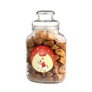 Nostalgisches Bonbonglas befüllt mit alt holländische Pfeffernüssen und einem Werbeetikett