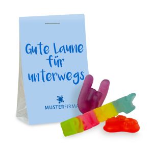 15 g veganes Fruchtgummi im transparenten Standbeutel mit beidseitig bedruckbarem Werbereiter