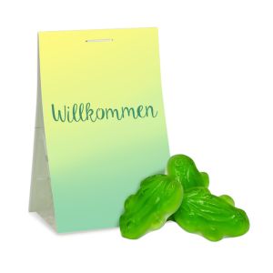 Grüne Frösche aus Fruchtgummi mit Schaumzucker im transparenten Standbeutel mit beidseitig bedruckbarem Werbereiter