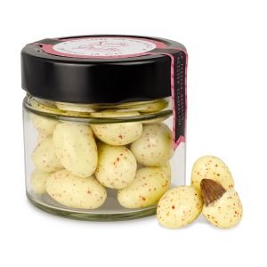 Rosa Pfeffermandeln mit weißer Schokolade im edlen Glas mit Werbeetikett