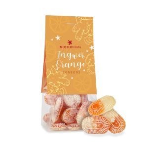 50 g Vegane Bonbons mit Ingwer-Orangengeschmack im transparenten Standbeutel mit beidseitig bedruckbarem Werbereiter