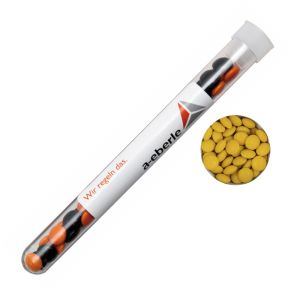 16 g gelbe Schoko-Linsen im Reagenzglas mit Werbeetikett