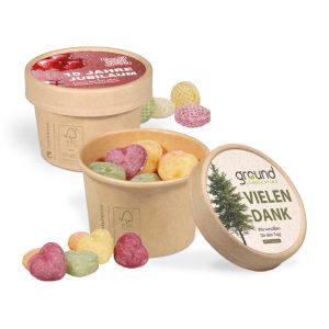 Paperbox mit Bonbons und einem Werbeeinleger im Deckel