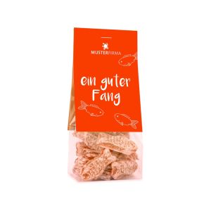 50 g orangene Bonbons in Fischform im transparenten Standbeutel mit beidseitig bedruckbarem Werbereiter