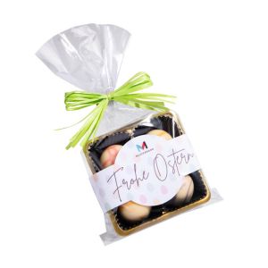 4 Fruchtpralinen im Klarsichtbeutel mit grüner Schleife und Etikett